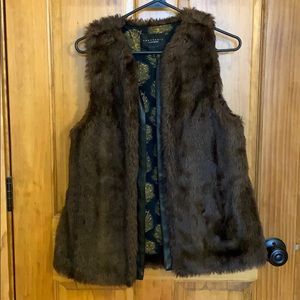 Small Faux fur vest with leather trim